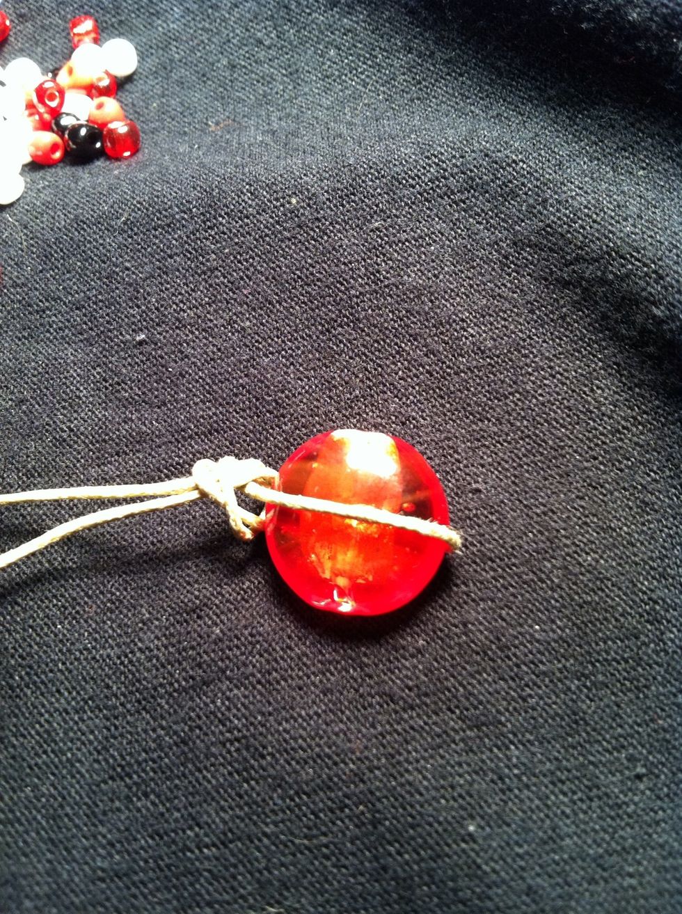 Wrap the loop around the large bead or button for measurement and tie and overhand knot to the correct size. If you're unsure how to make an overhand knot you can comment or msg me.