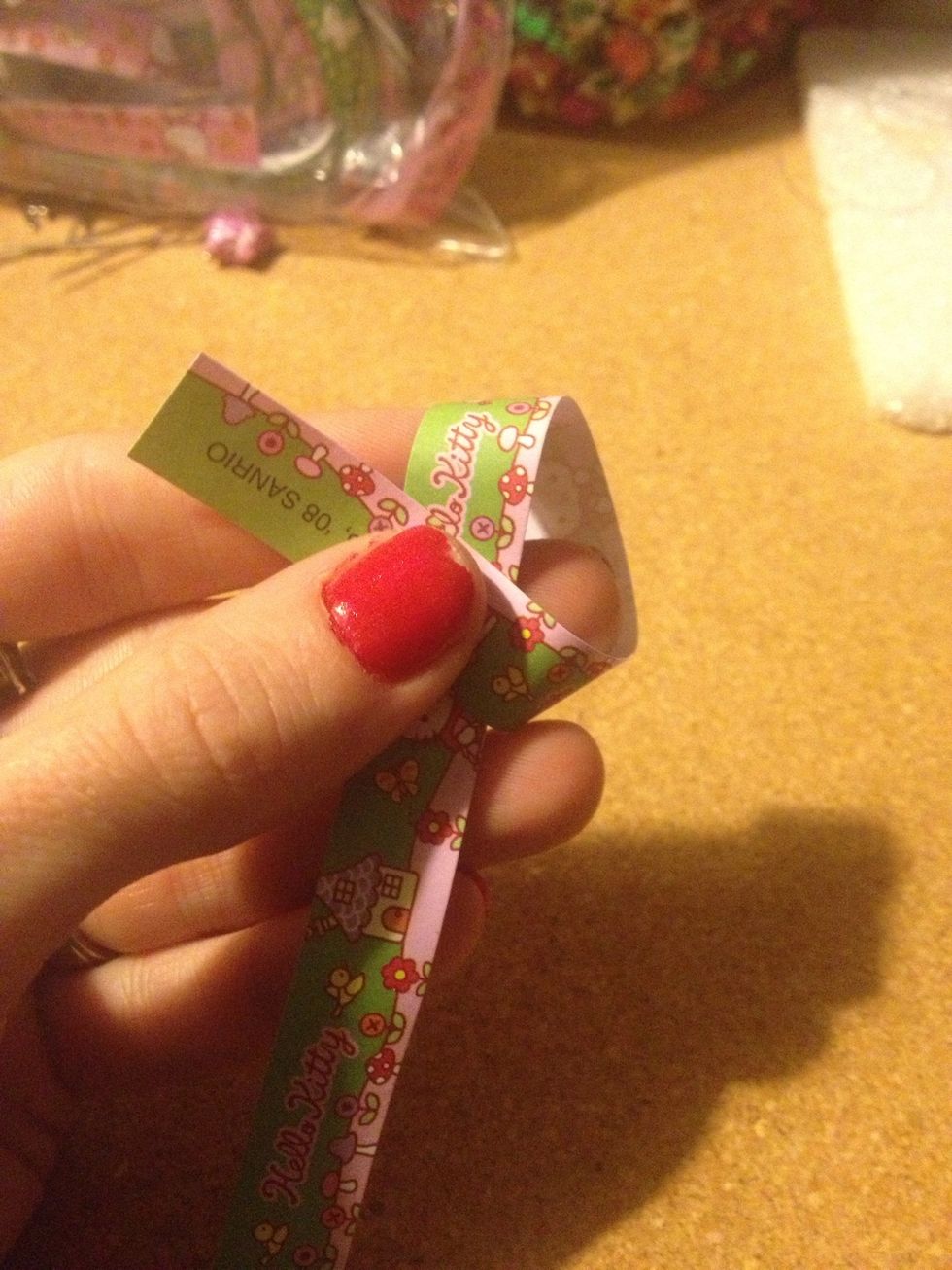 Wrap the paper around your finger(s).