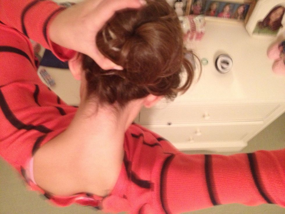 Wrap the remaking hair around the bun