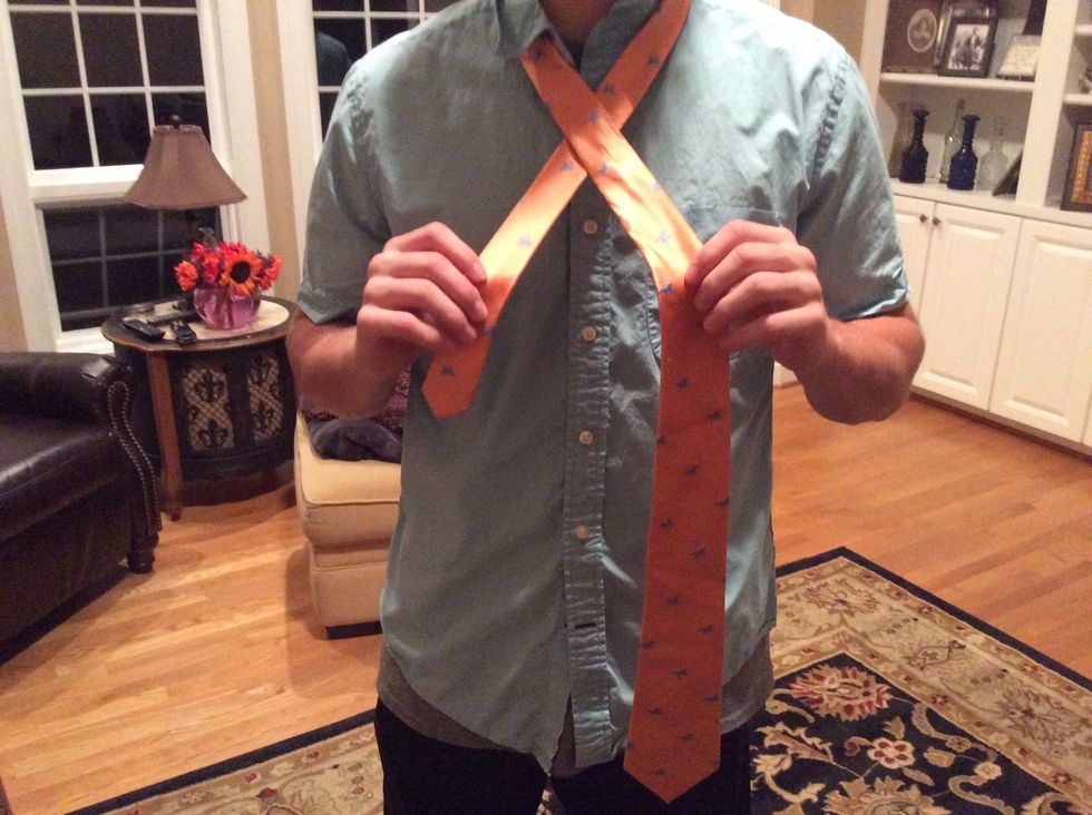 Wrap the skinny end under the fat end and to the right