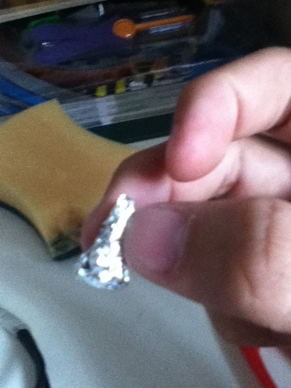 wrap the sponge cutout with aluminum foil. form a hershey's kiss-like shape but its important that the bottom part is FLAT.