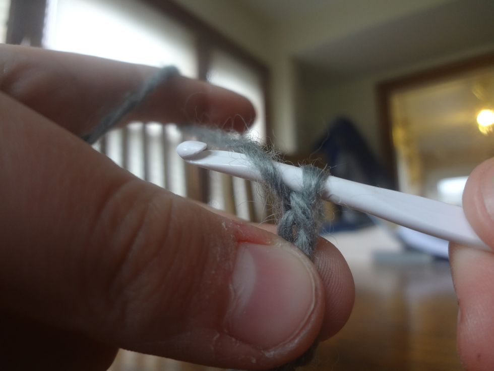 Wrap the string around the needle,
