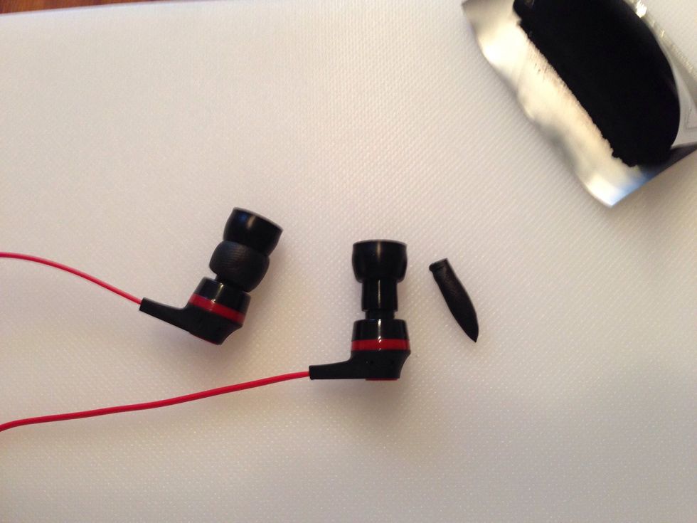 Wrap the sugru around the base of your earbuds