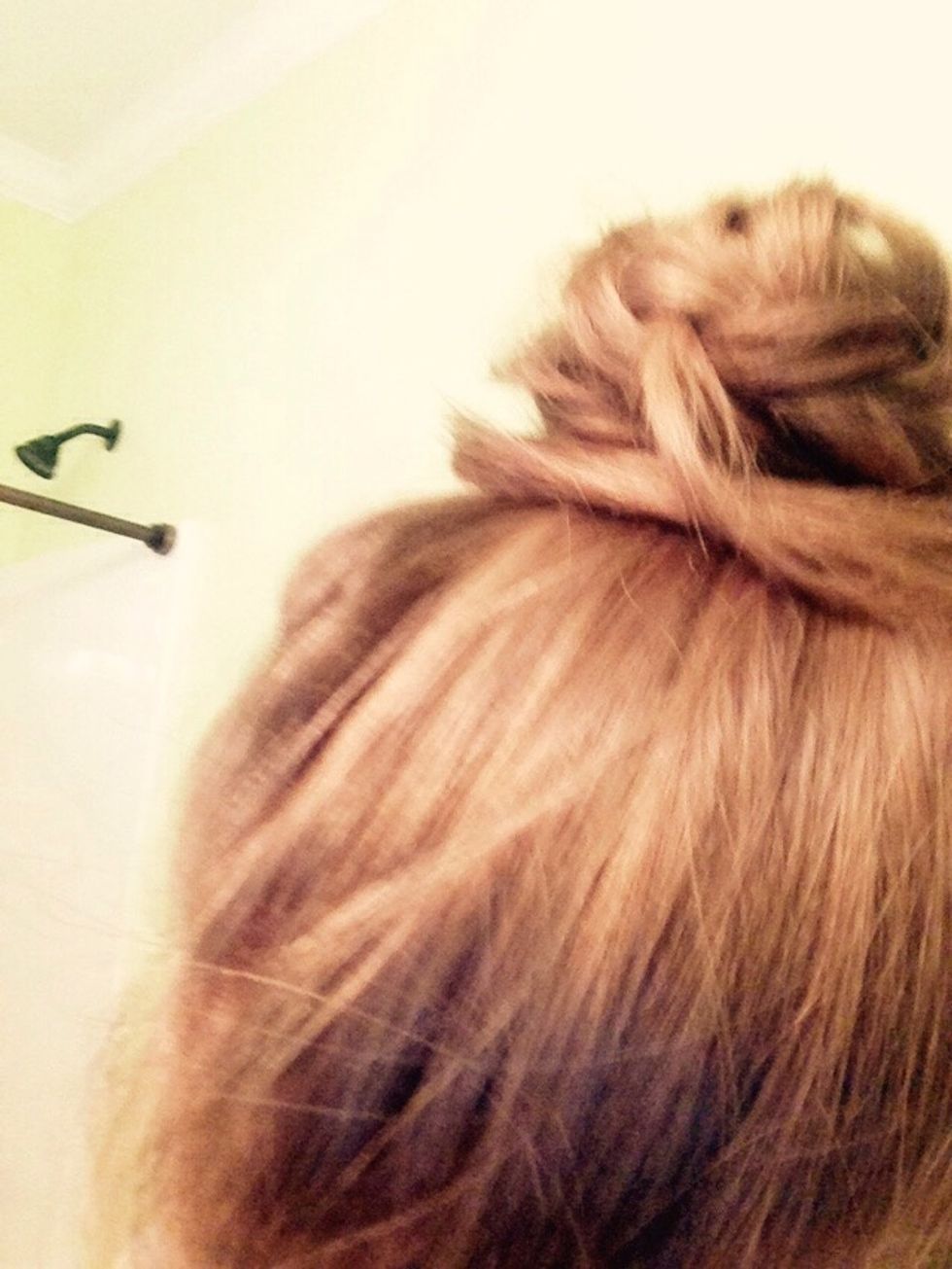 Wrap the tail around the bun and pin it