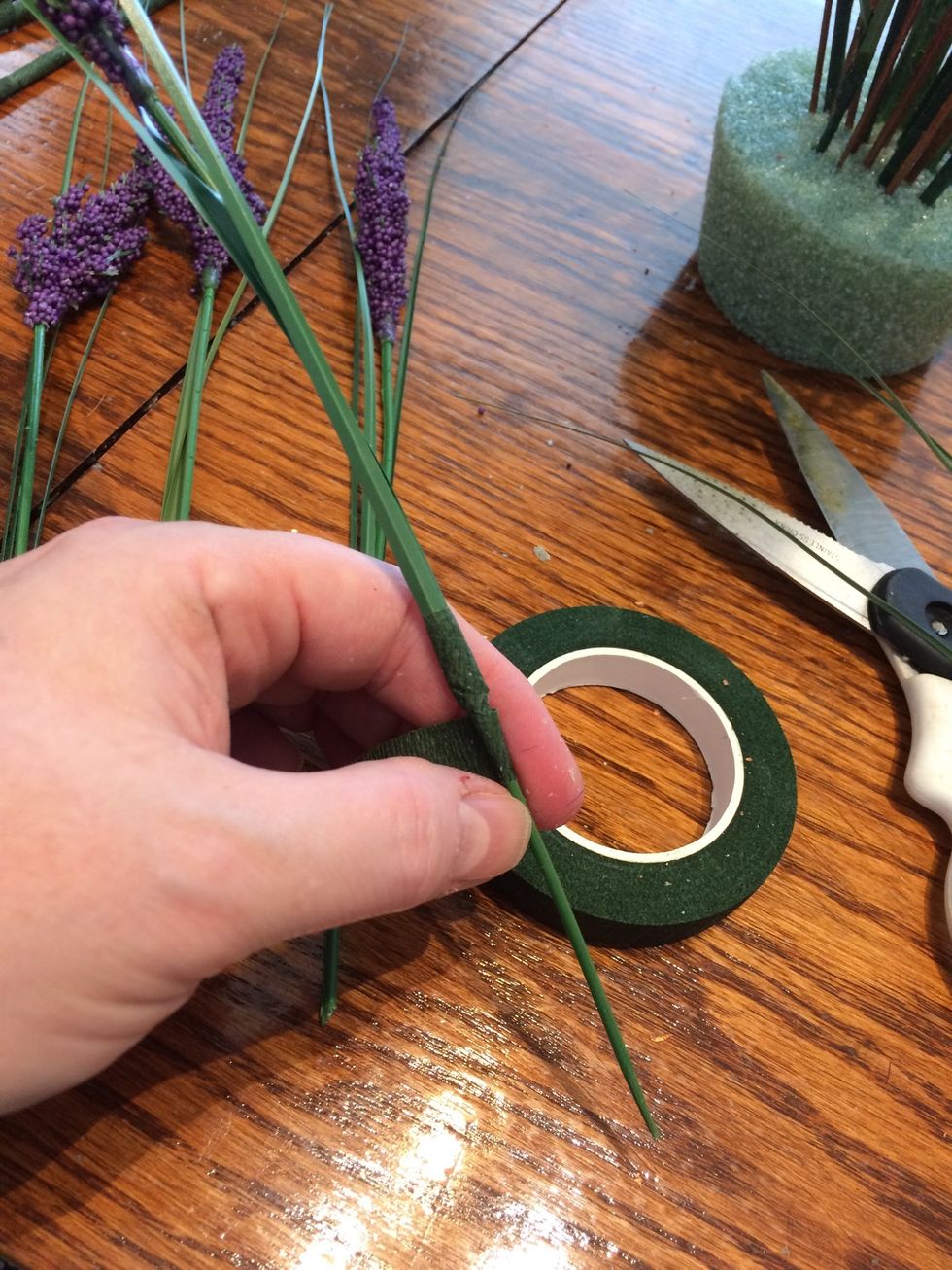 Wrap the tape around the grass piece to secure it to the stem. I secured the grass half way down the stem.