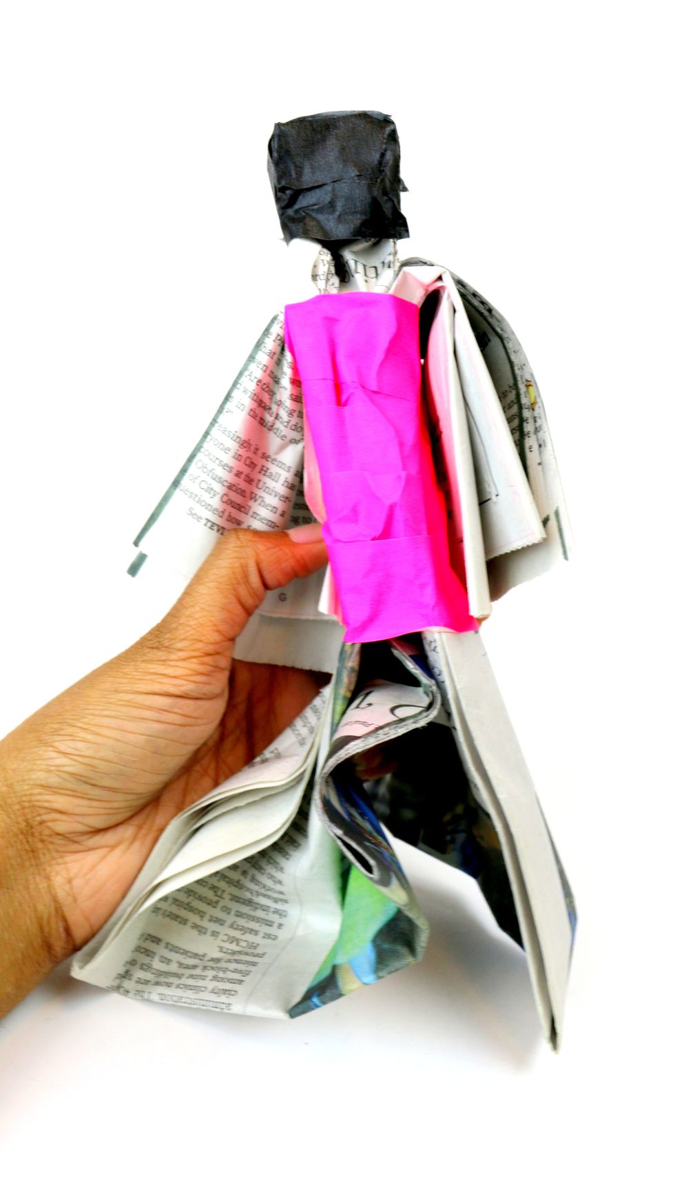 Wrap the tape from below the arms to the top of the legs. Here is how your figurine should look once you have finished taping the torso.