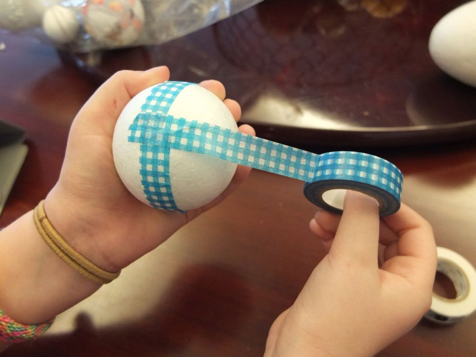 Wrap the Washi tape all the way around the ball and tear off once you have reached the end and over-lapped it.