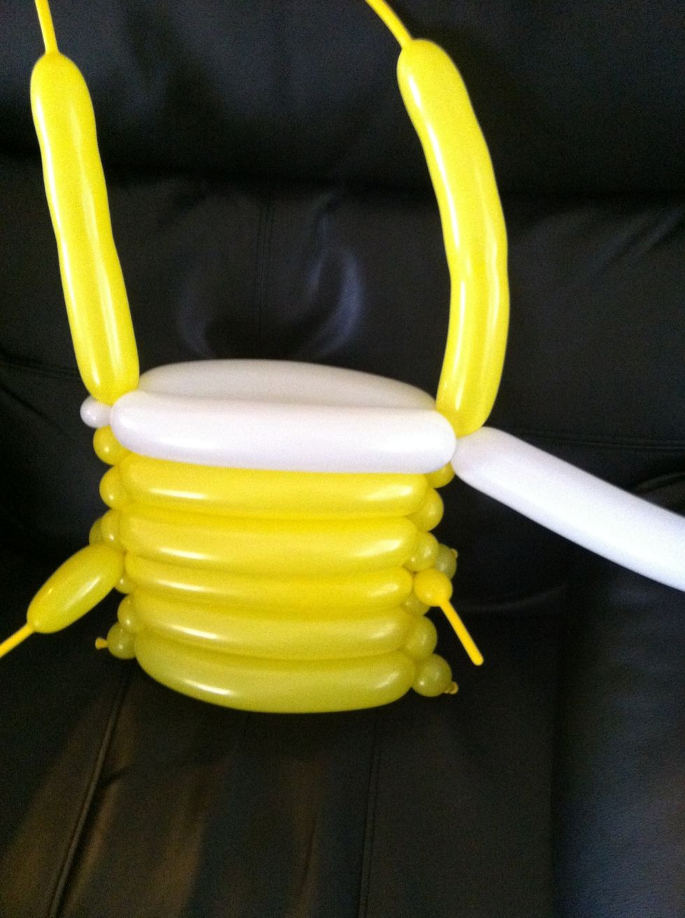 Wrap the white balloon back around to the other side