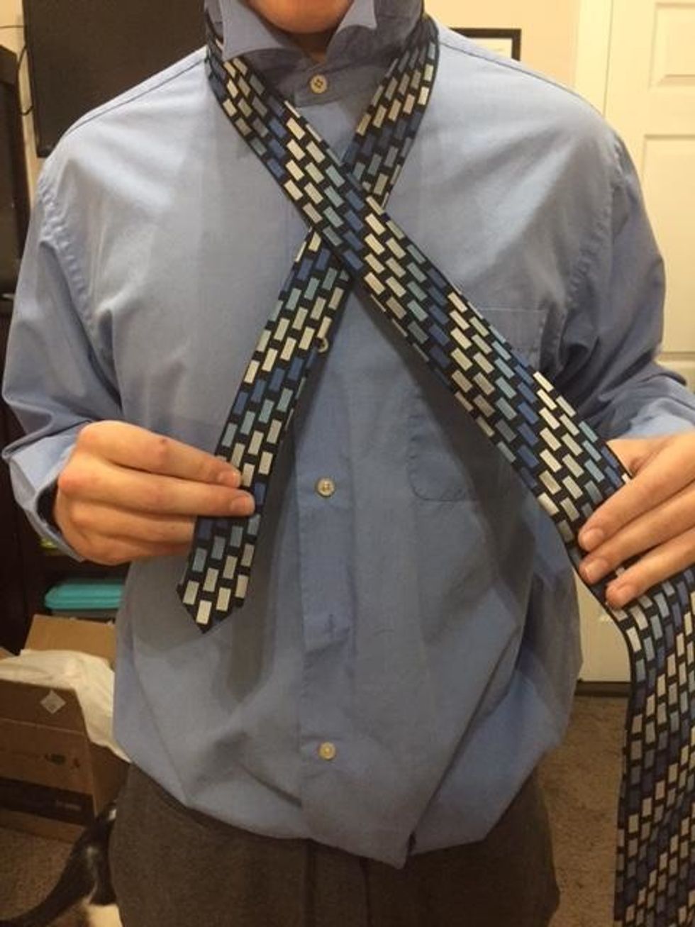 Wrap the wide end over the smaller end.