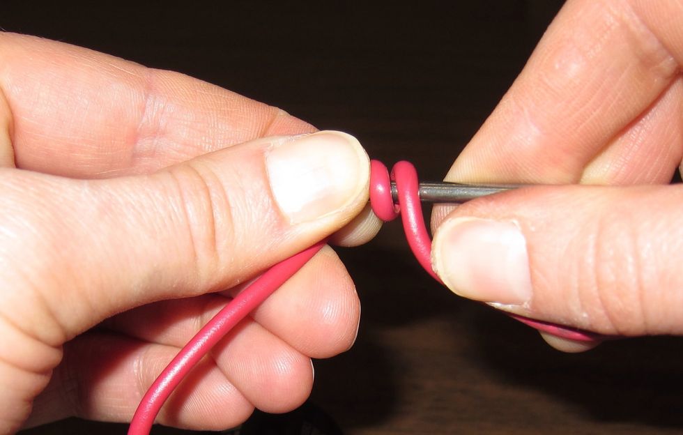Wrap the wire around the nail.