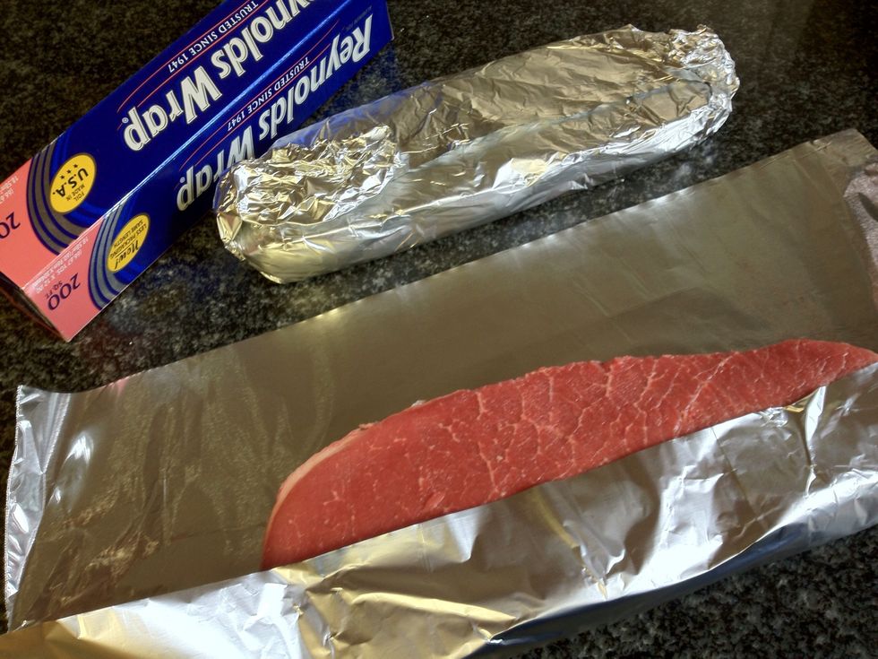 Wrap them in tin foil for a quick visit to the freezer. This step is to make the meat firm so it's easy to slice thin and even!