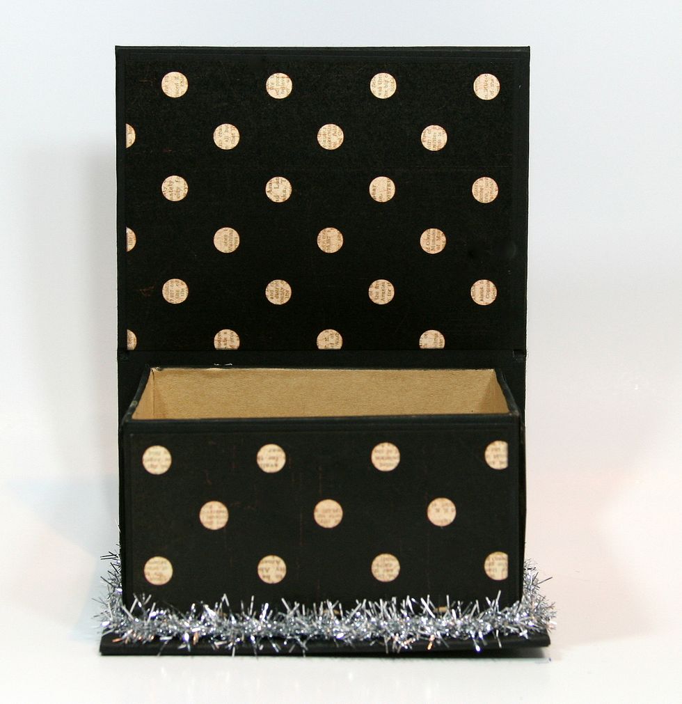 Wrap tinsel trim around base and secure.