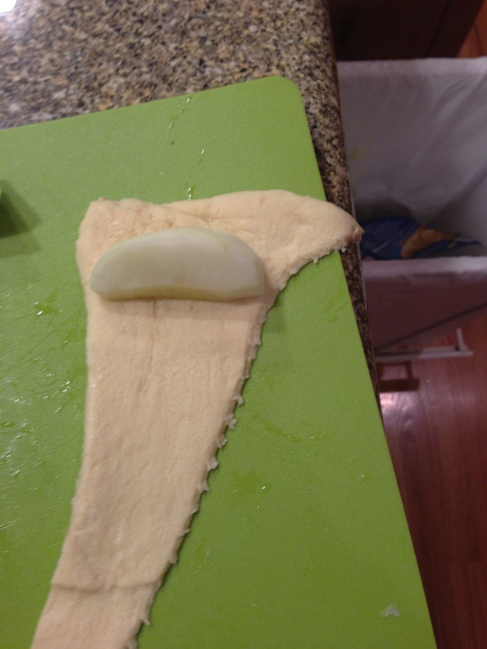 Wrap up an apple slice in the crescent roll