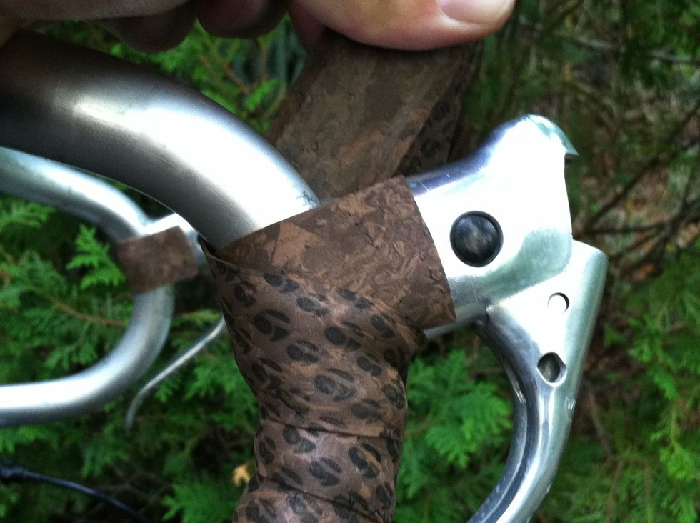 Wrap up, over the top of your lever, and around to the inside again.