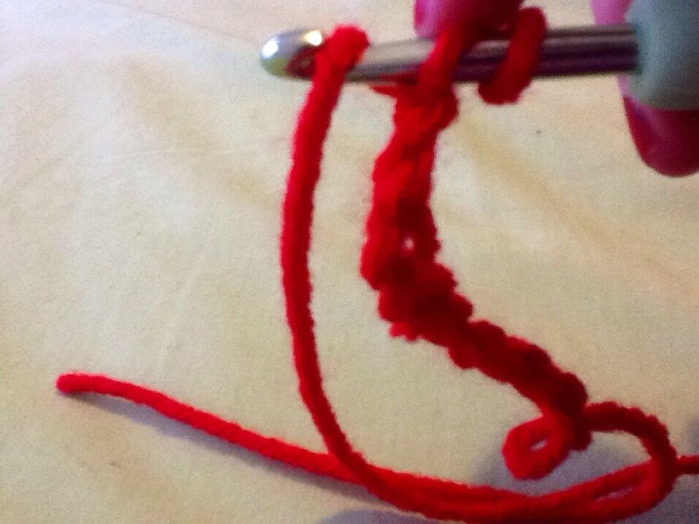 Wrap yarn around the top