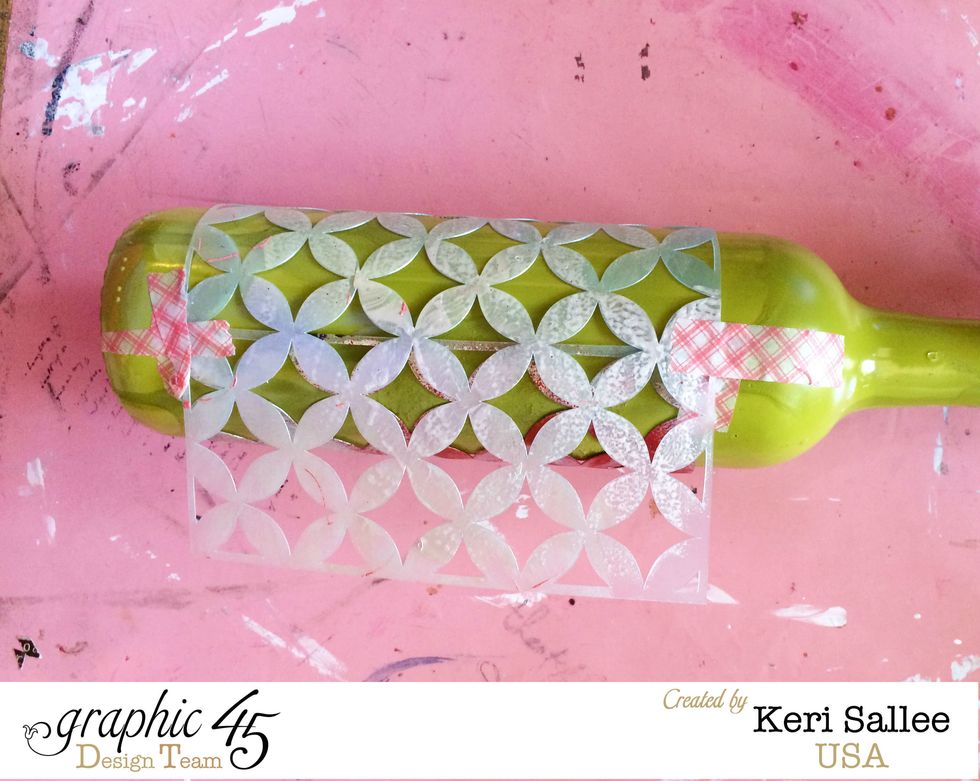 Wrap your bottle in yoru Pink Paislee Stencil. Tape it so that you still have access to the overlapped portion. Secure with tape (pretty washi tape never hurts right?!)