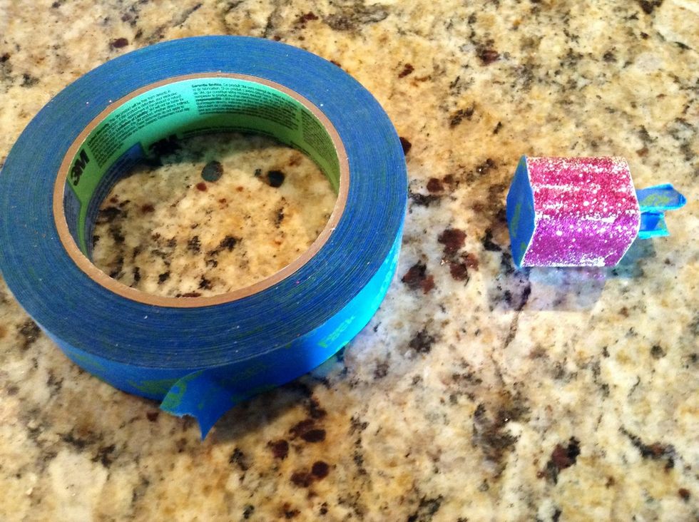 Wrap your charger with painters tape so no glitter gets into or onto important parts ( mine is glittered from a previous try that obviously did not work I used clear nail polish with nail glitter)