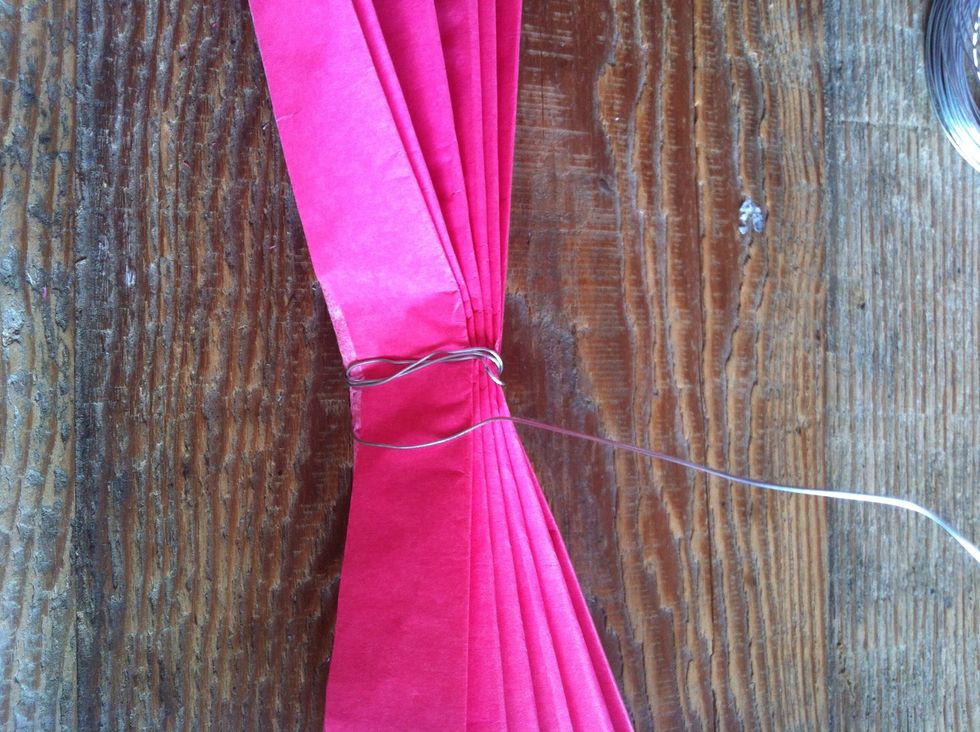 Wrap your craft wire around the centre crease a couple of times to secure it. Don't forget to create a small loop with your wire, it'll help with hanging them up.