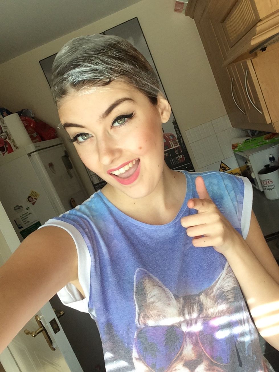 Wrap your head up in cling film for 20 - 60 minutes. This locks in the product & heat, helping the product to break down the colour. (And also protects you from getting it on the furniture!)