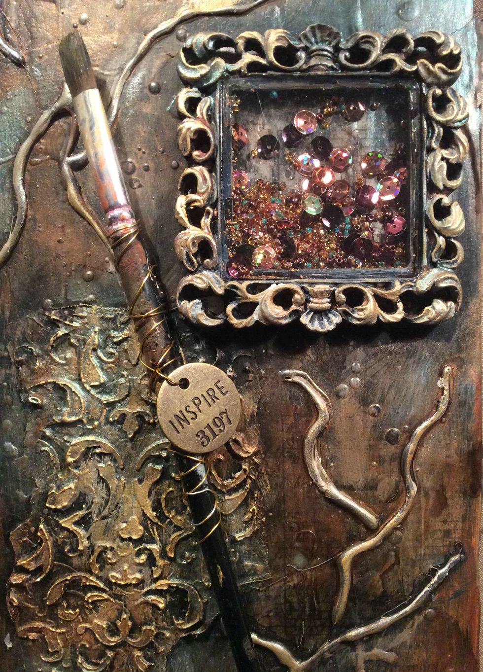 Wrapped wire and attached charm to my old paint brush. Glued this down using E6000 glue.