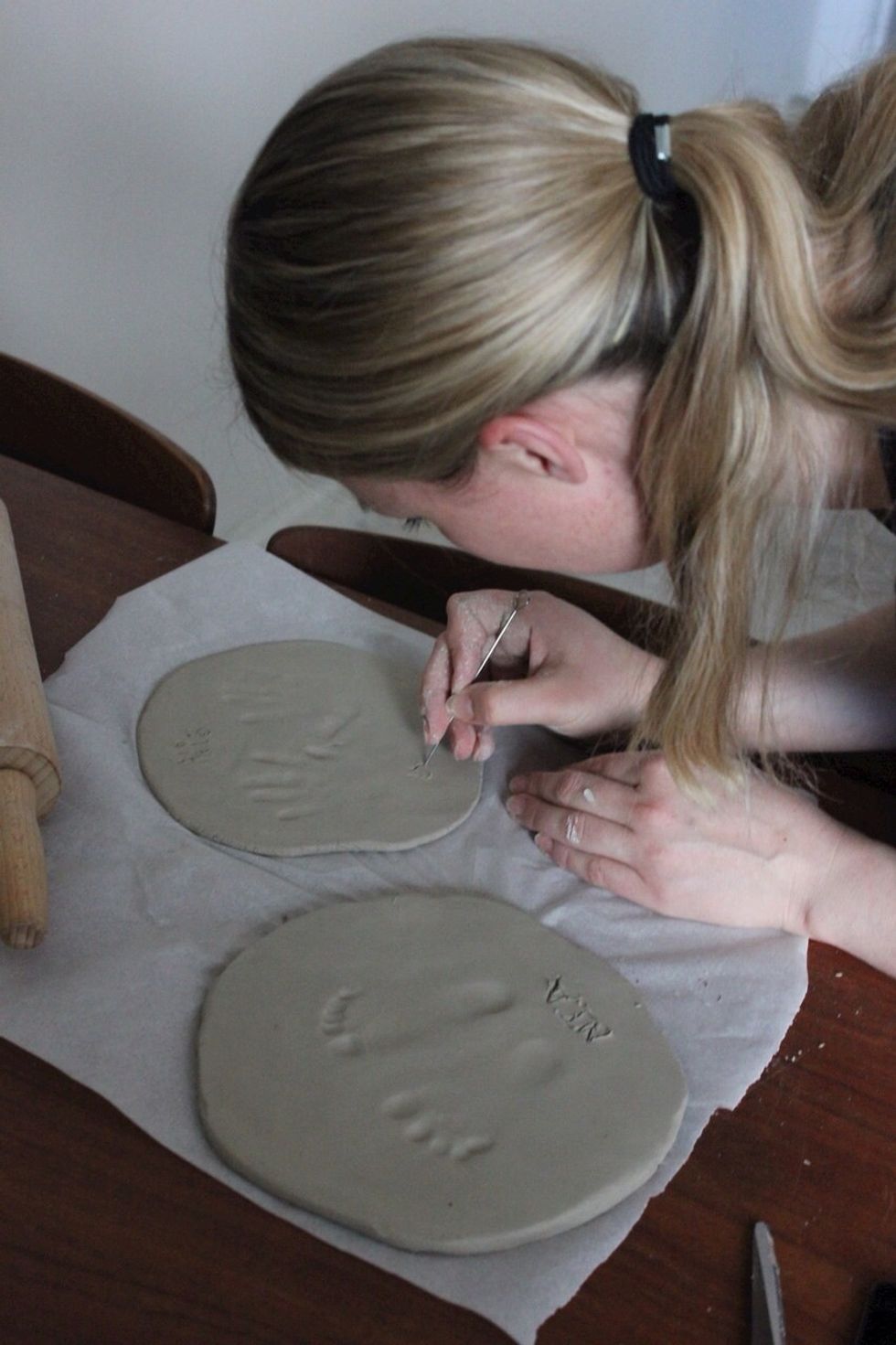 Write name and/or date into the clay using a pencil or other sharp objects