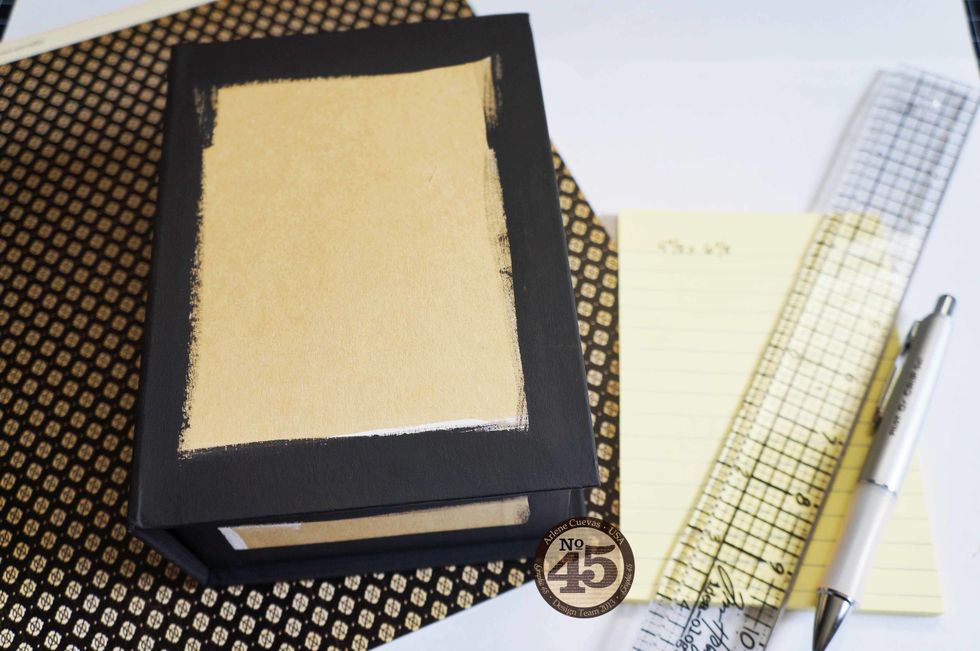 Write your measurements down and select the design paper you will be trimming down for the cover of your box.