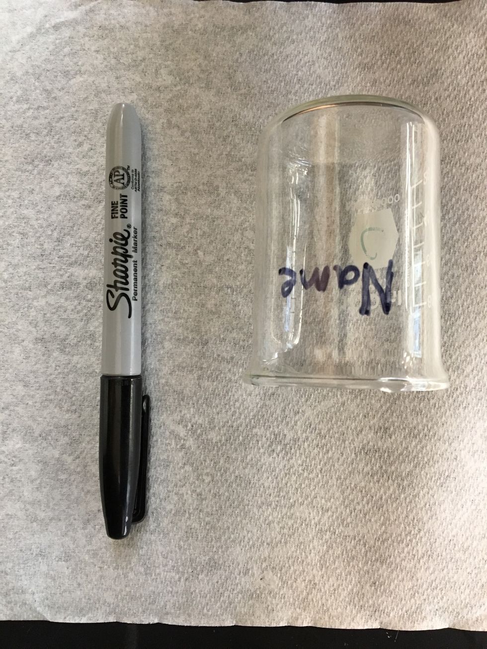 Write your name on a 100 mL beaker using a permanent marker.