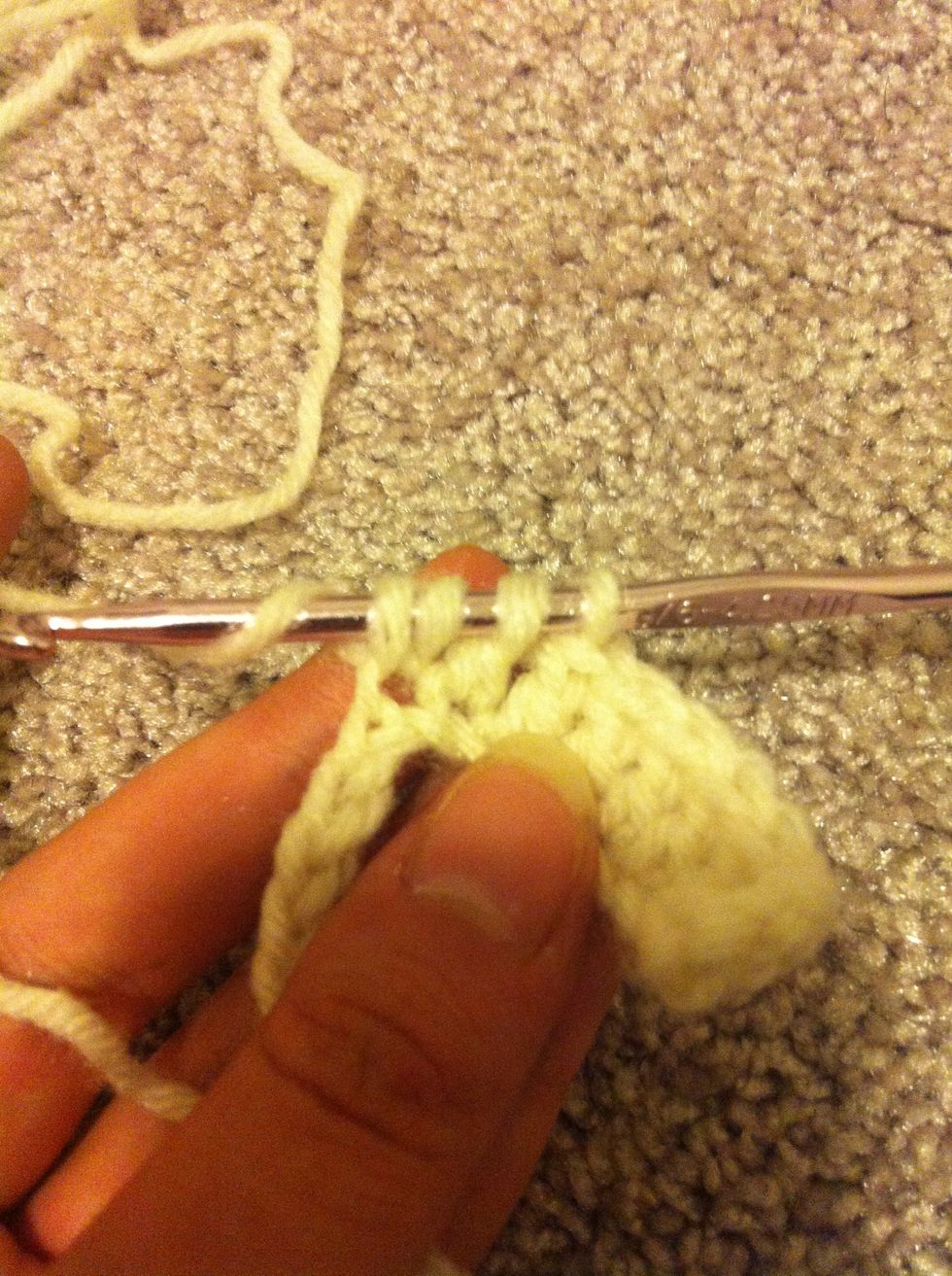 yarn around and pull through the first 2 loops, but leave this stitch unfinished as well.