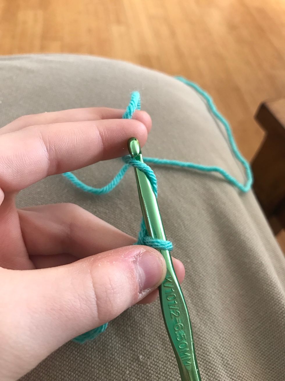 Yarn over but don't pull through the yarn