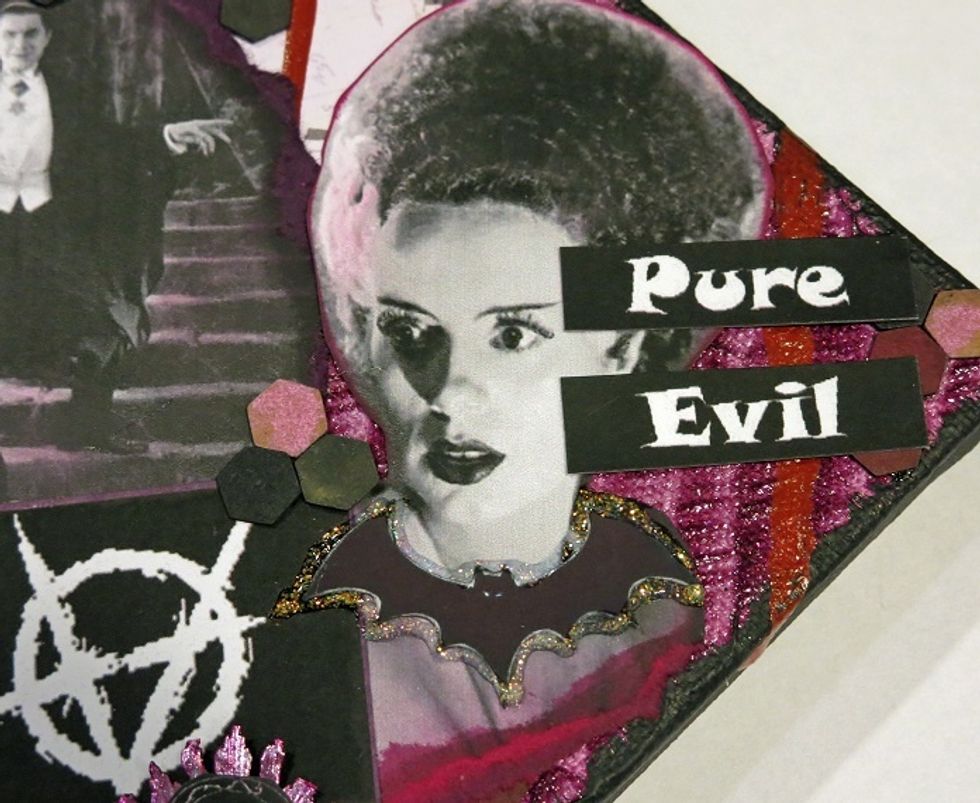 Yes, I know she is the bride of Frankenstein, but I like her here anyway. I used a bat image outlined with clear stickles to create her necklace.