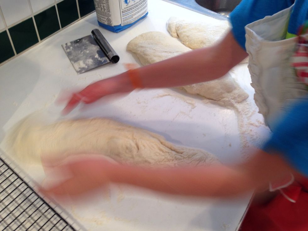 Yes, I said slapping. Hildegard demonstrates how to slap the dough between your hands, back and forth. Most bread requires punching and kneading, but not this. Slap10, 20 times.