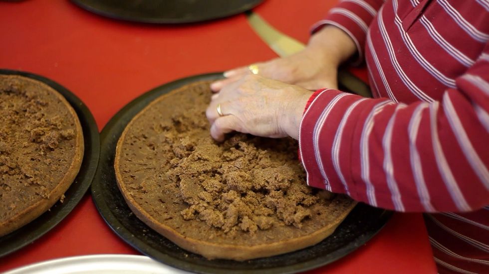 Yes literally digging in. Carefully remove as much crumbs out of the centre of the cake as you can without reaching the bottom. Crumbs from one cake layer should be enough.