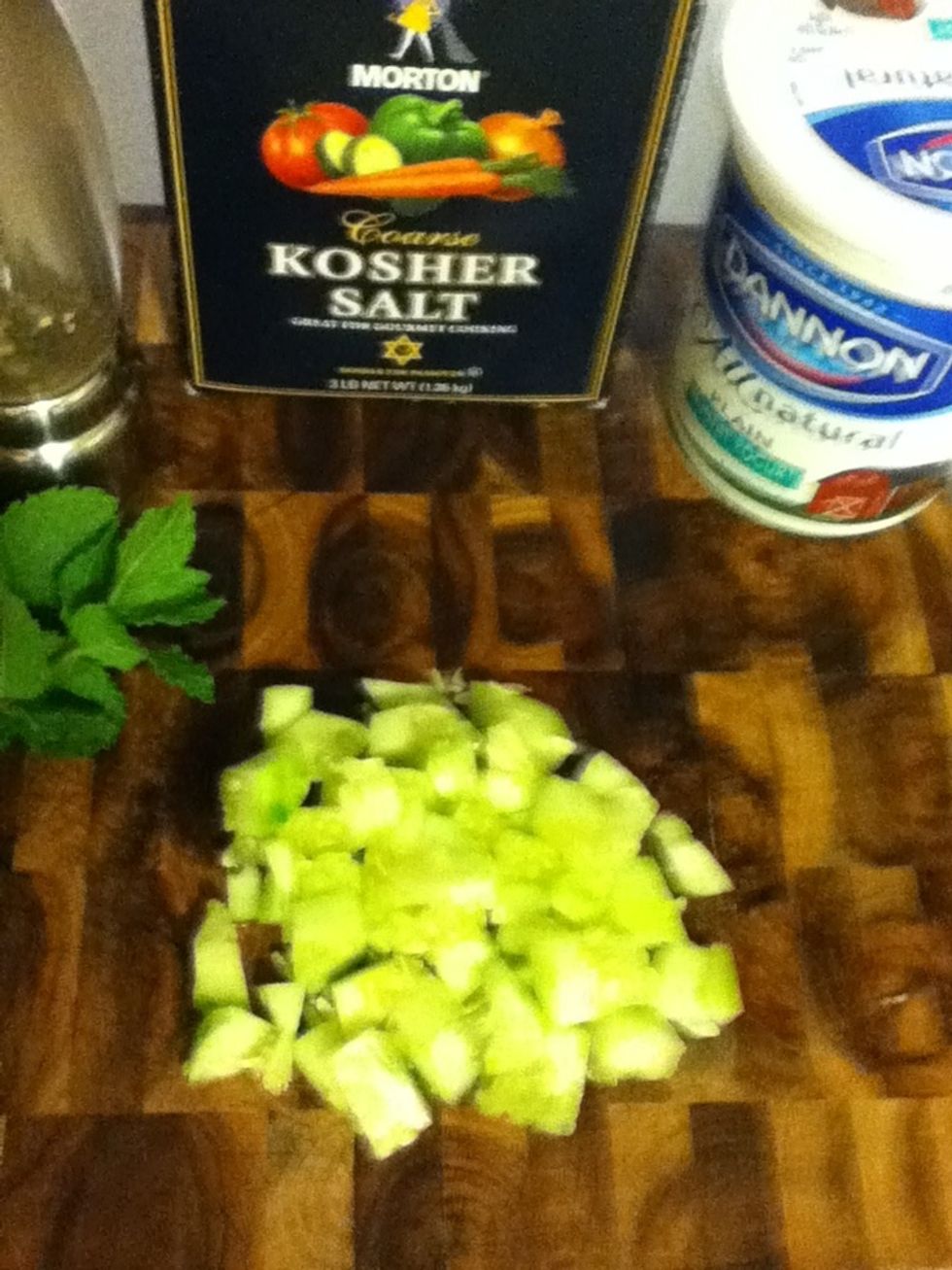Yogurt sauce (raita) is easy. Chop the other half of the cucumber and squeeze out the water.