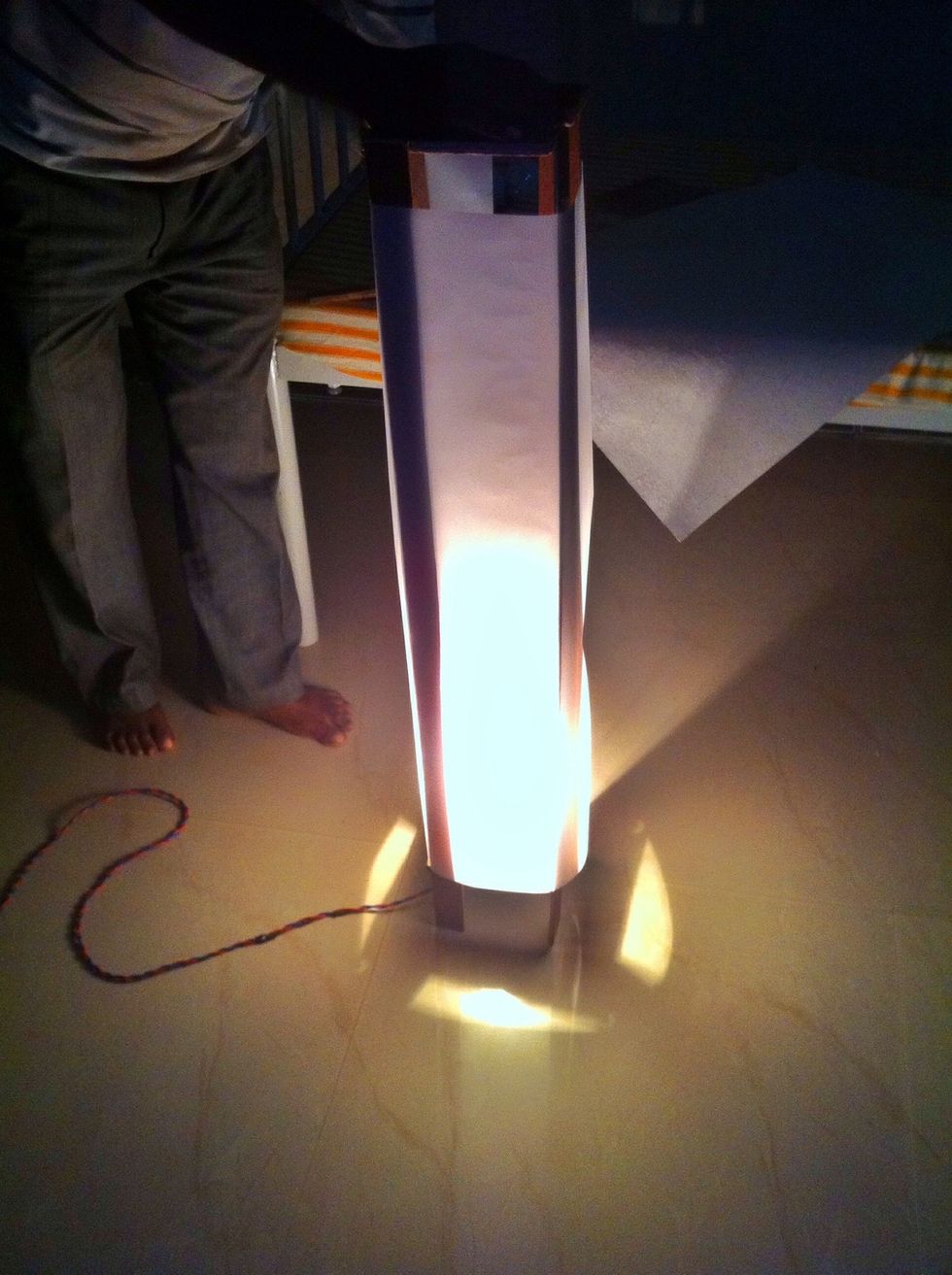 Yohooo.! You are done now. Photo resolution is low thats why it looks like there is no light at the upper end. But there is dim lightFor more light you may attach one more bulb on upper platform too.