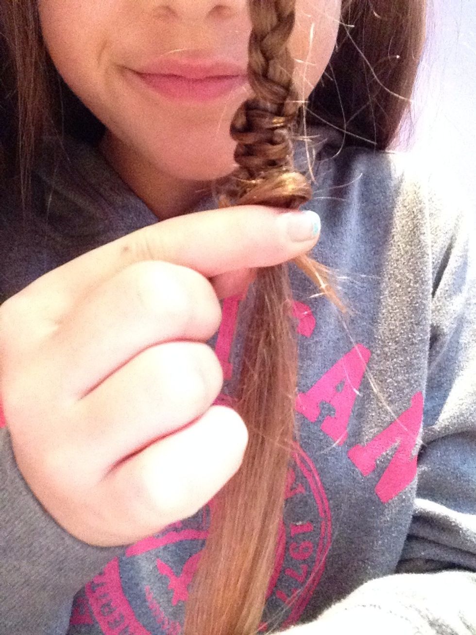 you are going to hold the middle strand, and push the two sides up to the top!!\ud83d\udc9b