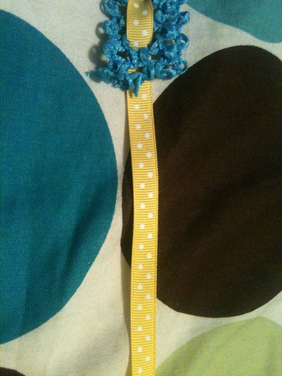 You are going to leave about a good foot and a half of ribbon on both ends to tie a bow.