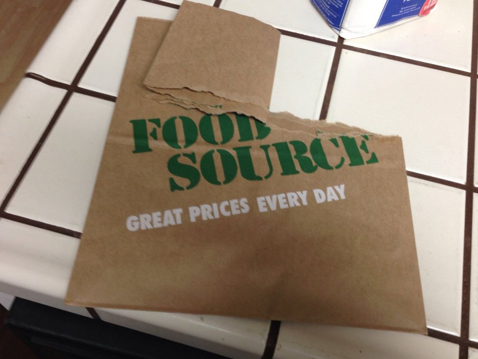 You are going to tear half of the bag and fold the ends