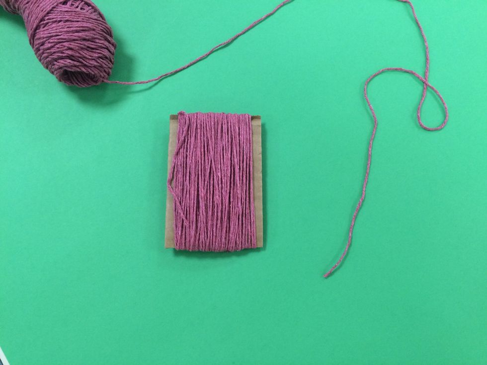 You are now ready to add a piece of yarn that will help you hang the tassel.