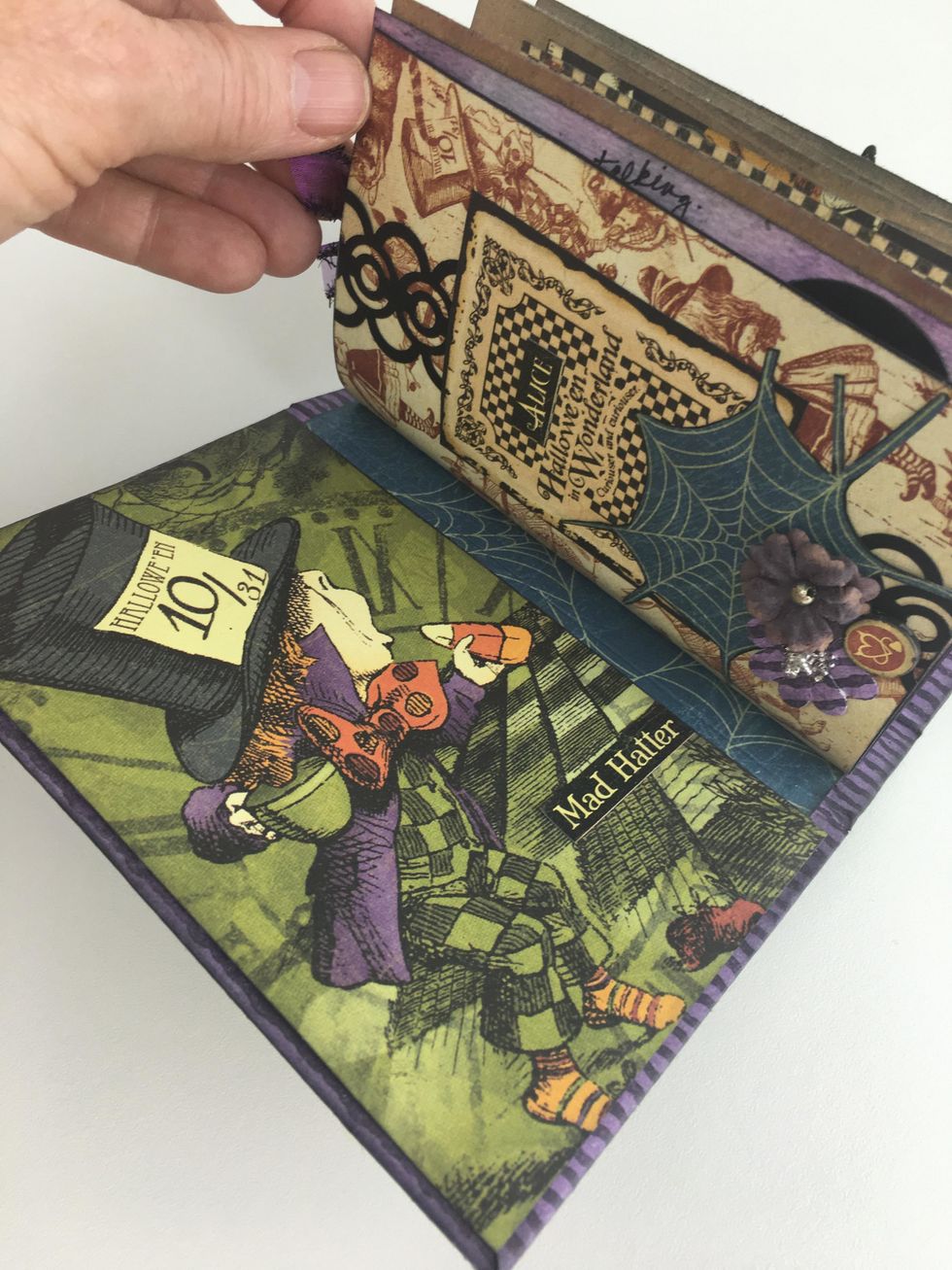 You are now ready to add trim, tags, spider webs, quotes, notes etc. into your junk journal.
