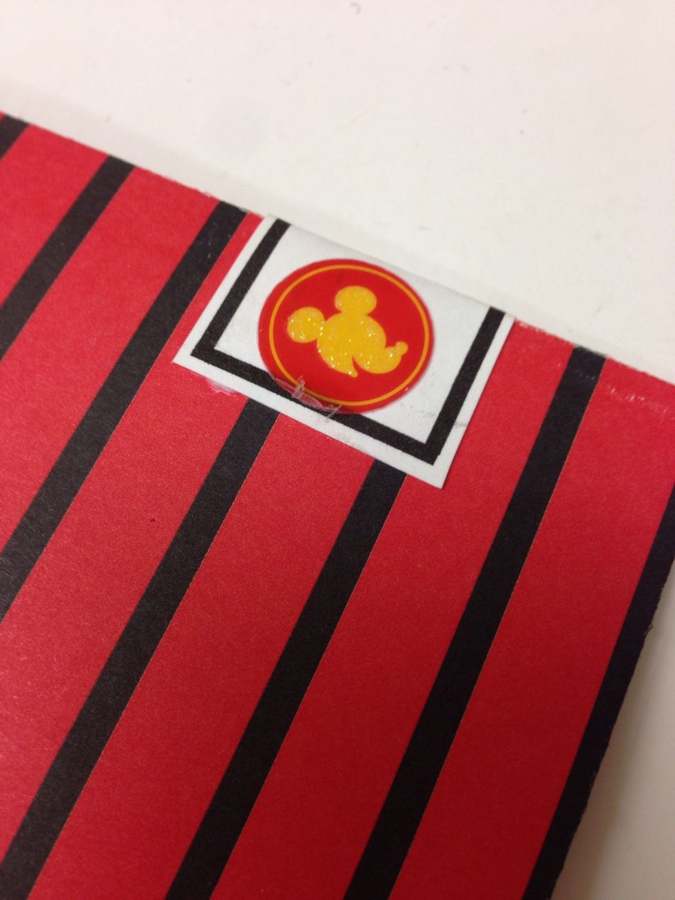 You can add a little sticker to the back side of the banner to help tie it in with the rest of the album.