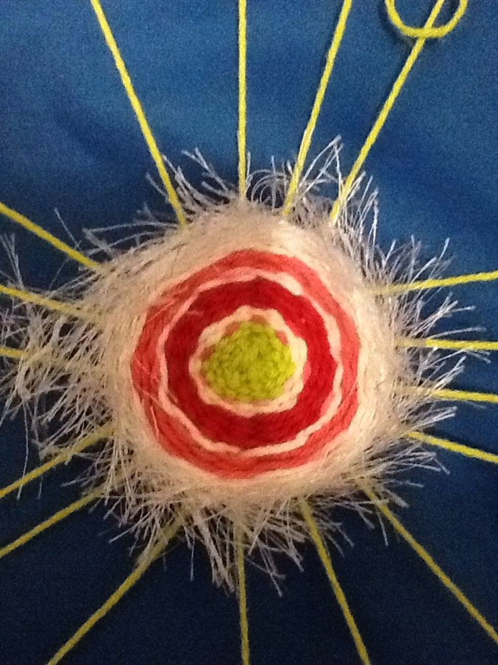 You can add not only different color yarns but also yarns with different textures. You can even add ribbon or anything you can weave around the loom.