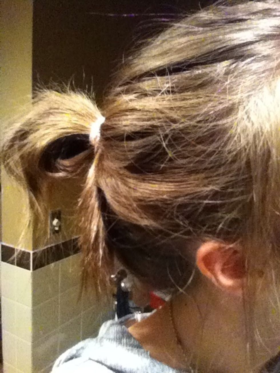 You can also choose to pull some hairs out of the actual bun to make it even more messy