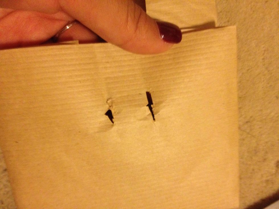 You can also decorate it by poking two holes to string ribbon through! Don't worry about making the holes neat, just make sure they are even and long enough to fit the ribbon