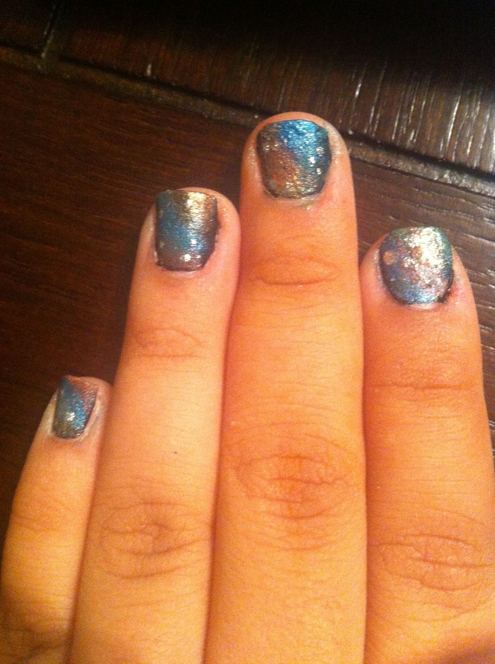 You can also dot some silver or white nailpolish to create the look of star clusters