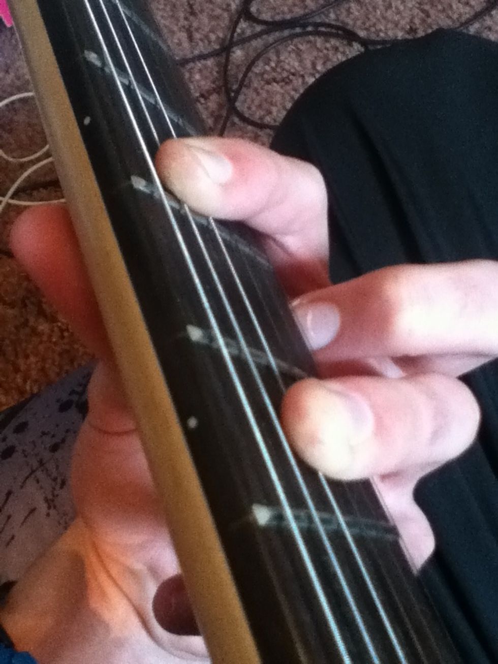 You can also play down one string, this would be a C chord. Here, you could mute the top string by just touching it with the first finger.