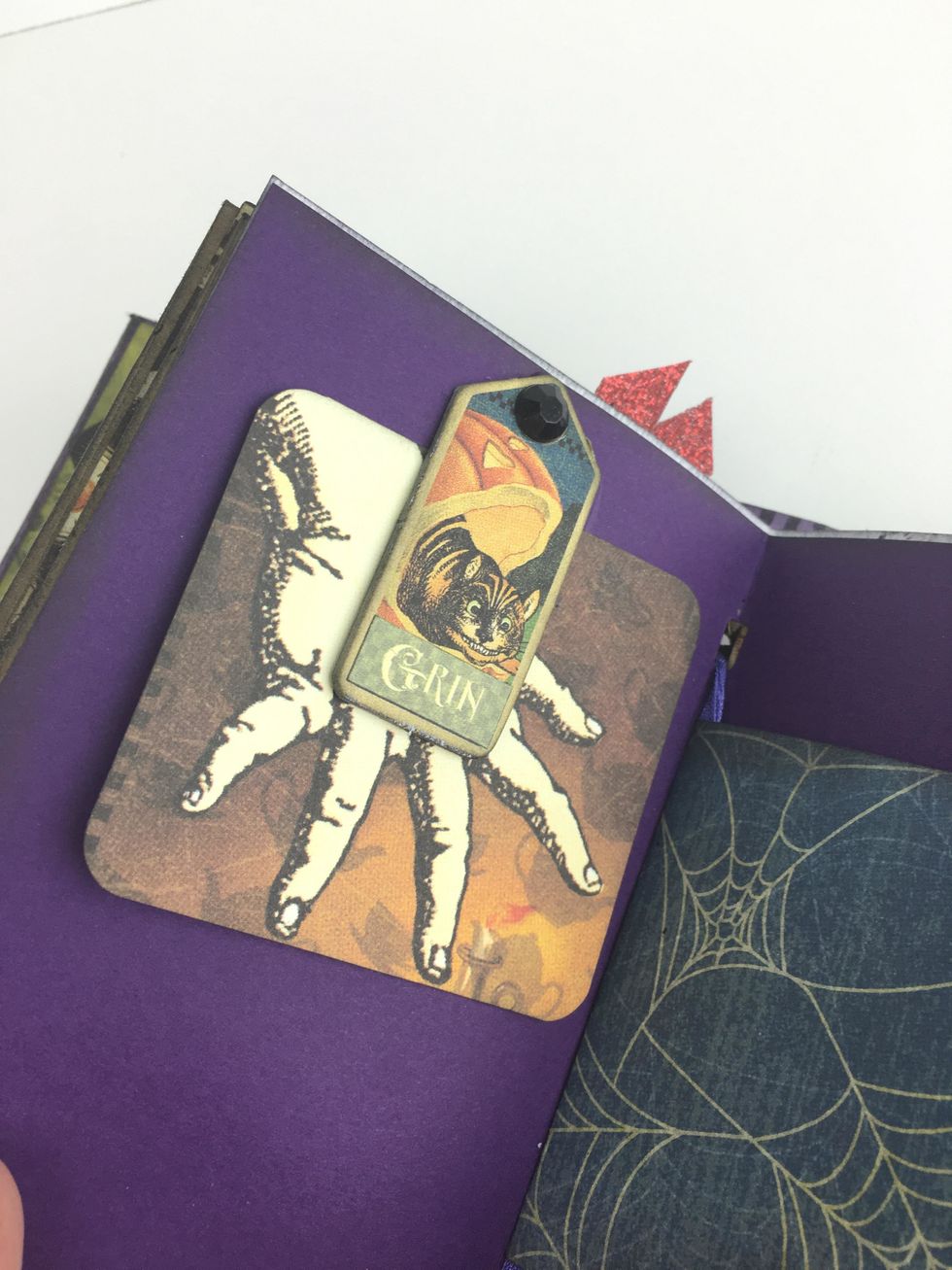 You can also use chipboard tags and rhinestones to create tuck spots in your junk journal.