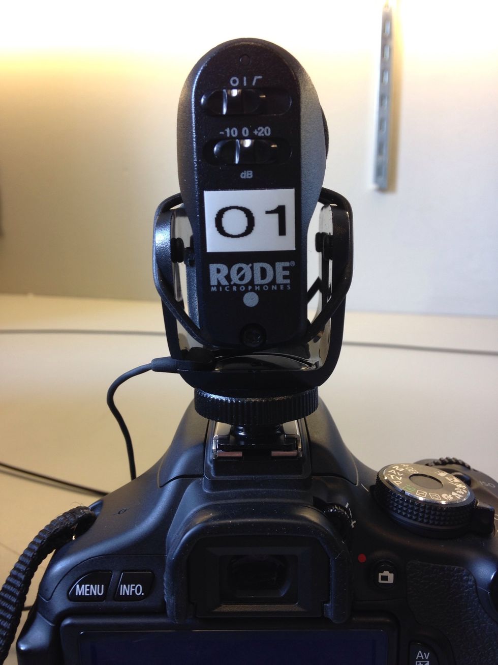 You can attach a Shotgun microphone for better audio. Slide the mic into the top of the DSLR. Twist the circular lock to the left to fasten. Turn the mic on by moving the top switch to the middle.