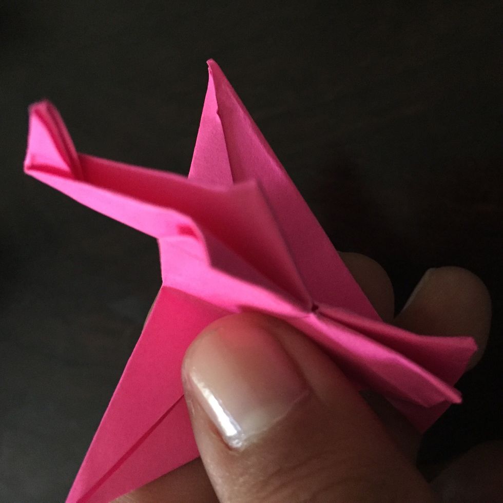 You can bend the "feet" so it can stand up.