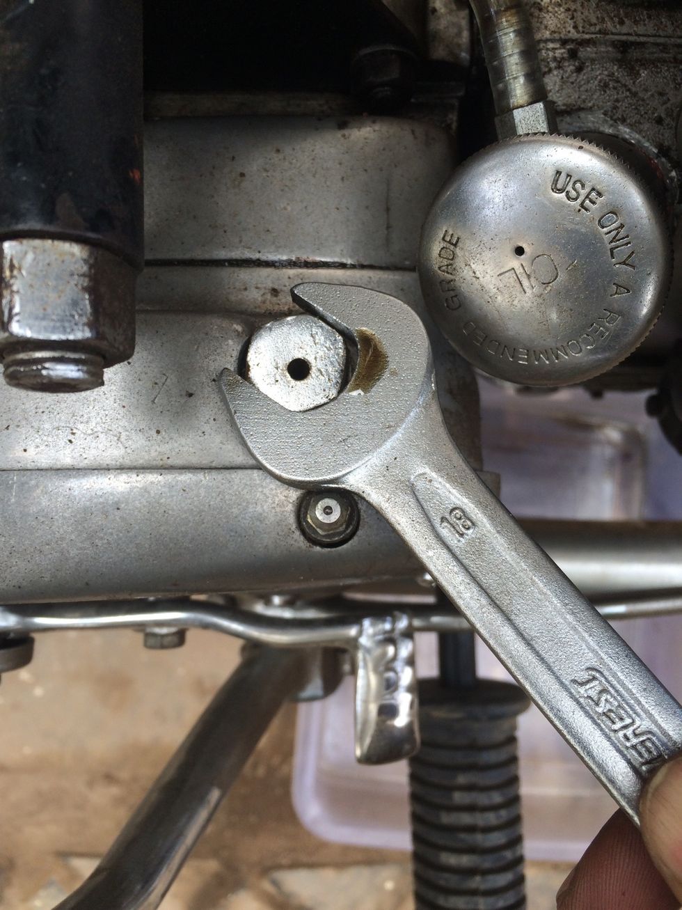 You can choose to open it using 18mm spanner as well, but be careful not to spoil the grease nipple nearby