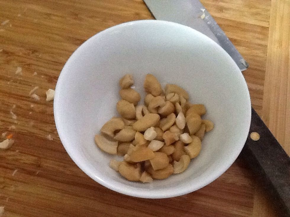 You can chop the cashews up briefly if you want to.  You then put the cashews in another bowl.